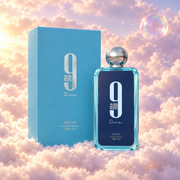 The bottle of 9 AM Dive by Afnan next to its original box, on clouds.