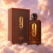 The bottle of 9 PM Elixir by Afnan next to its original box, on clouds.