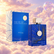 The bottle of Club de Nuit Blue Iconic by Armaf next to its original box, on clouds.
