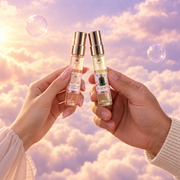 Her hand and his, toasting with the Club de Nuit Woman and Rey de Reyes vials