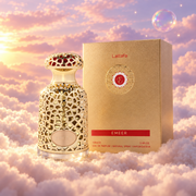 The bottle of Emeer by Lattafa next to its original box, on clouds.