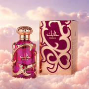 El frasco de Habik de Lattafa junto a su caja original, sobre nubes.