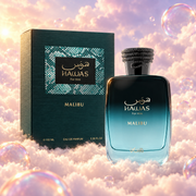 The bottle of Hawas Malibu by Rasasi next to its original box, on clouds.