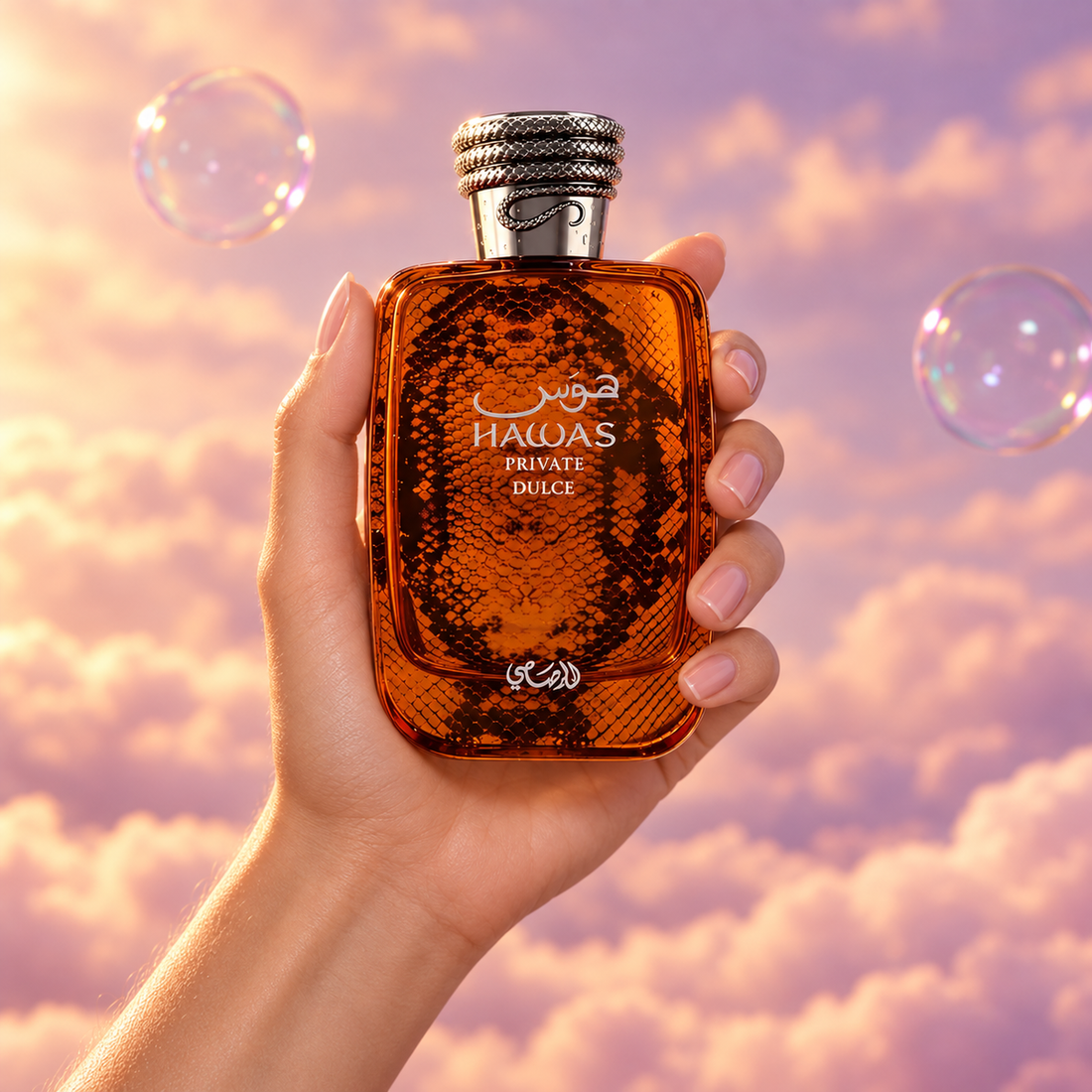 A hand holds the bottle of Hawas Private Dulce by Rasasi among pink clouds.