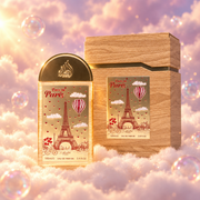 El frasco de Love in Paris de Lattafa junto a su caja original, sobre nubes.
