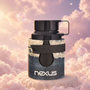 Bottle of Odyssey Nexus by Armaf on a bank of clouds, in a pink and lavender sky with iridescent bubbles and golden light.