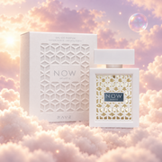 The bottle of Rave Now White by Lattafa next to its original box, on clouds.