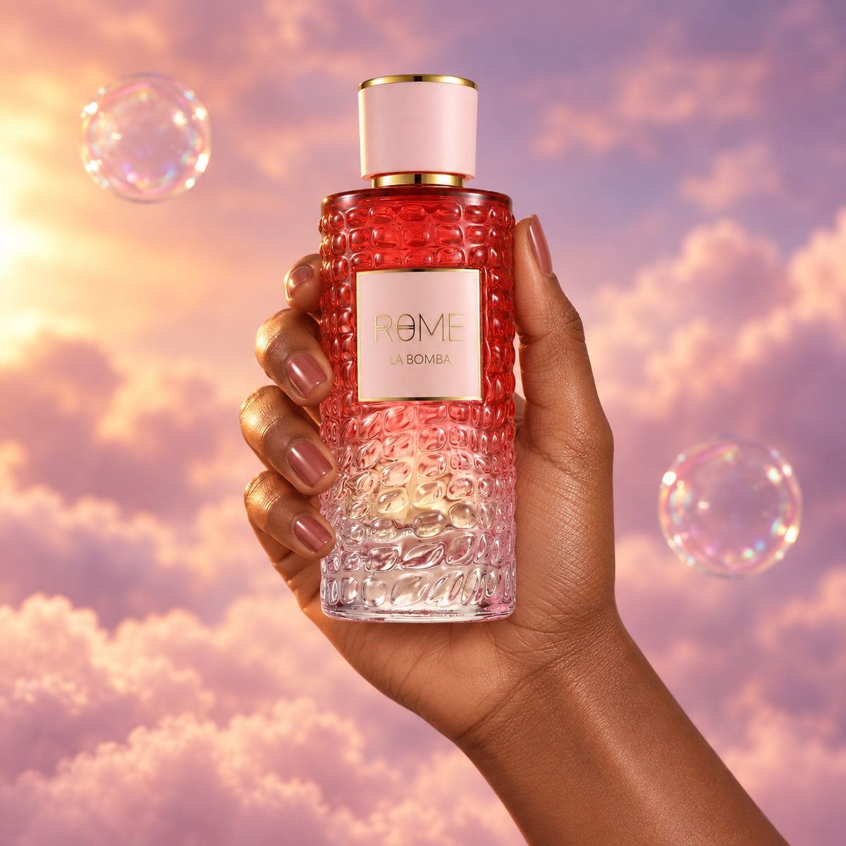 A hand holds the bottle of Rome La Bomba by Bharara among pink clouds.