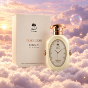 The bottle of Timeless Legacy by Zakat next to its original box, on clouds.