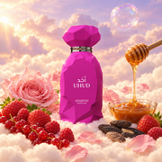 The bottle of Uhud by Arabiyat Prestige surrounded by red berries, rose, tonka bean and honey, on clouds.